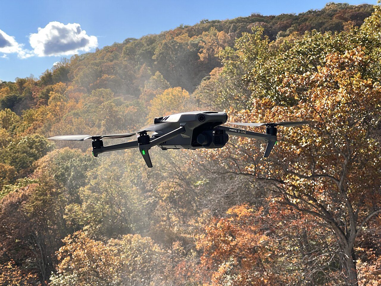 Drone flying near a forest