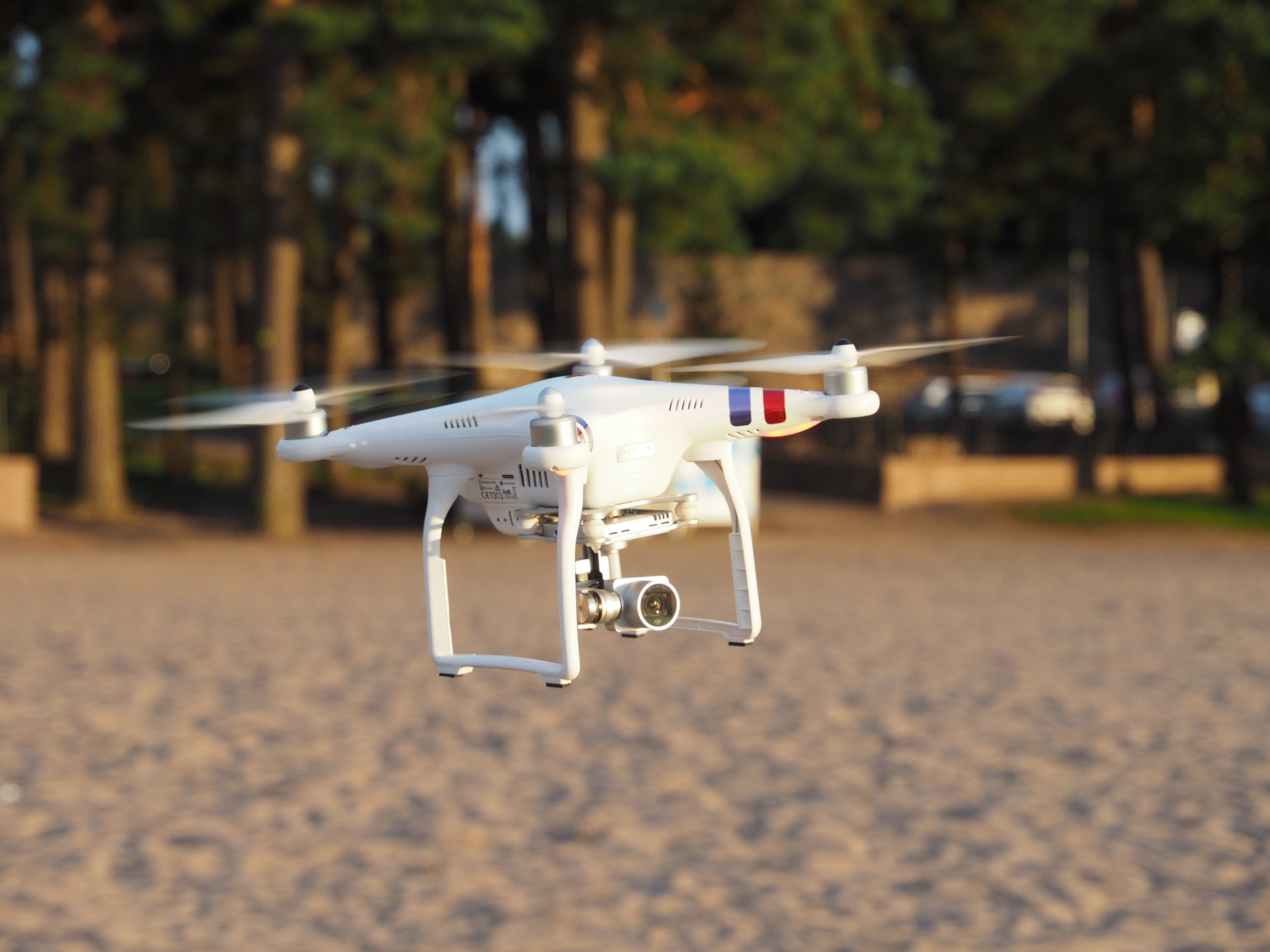 Small drone being flown outdoors